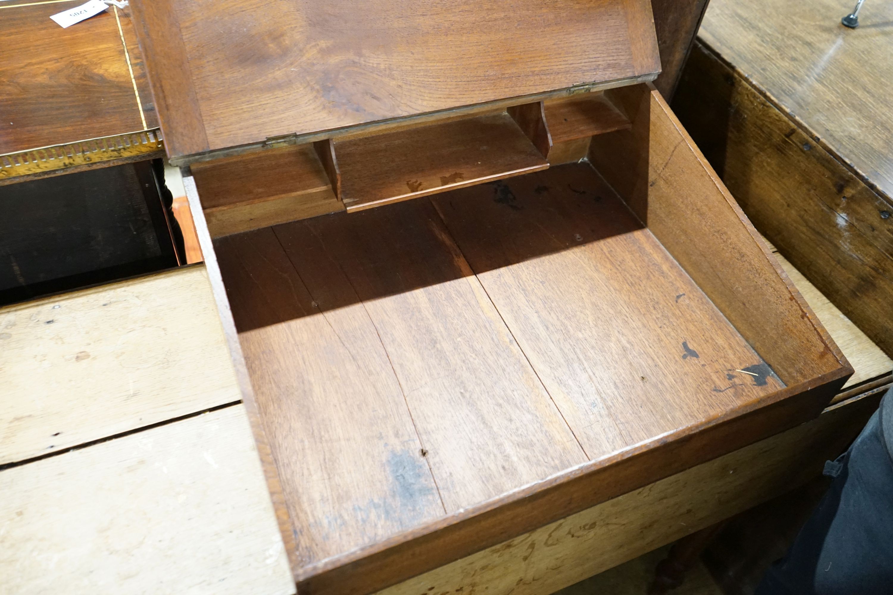 A red walnut clerk's desk and an oak Pembroke table